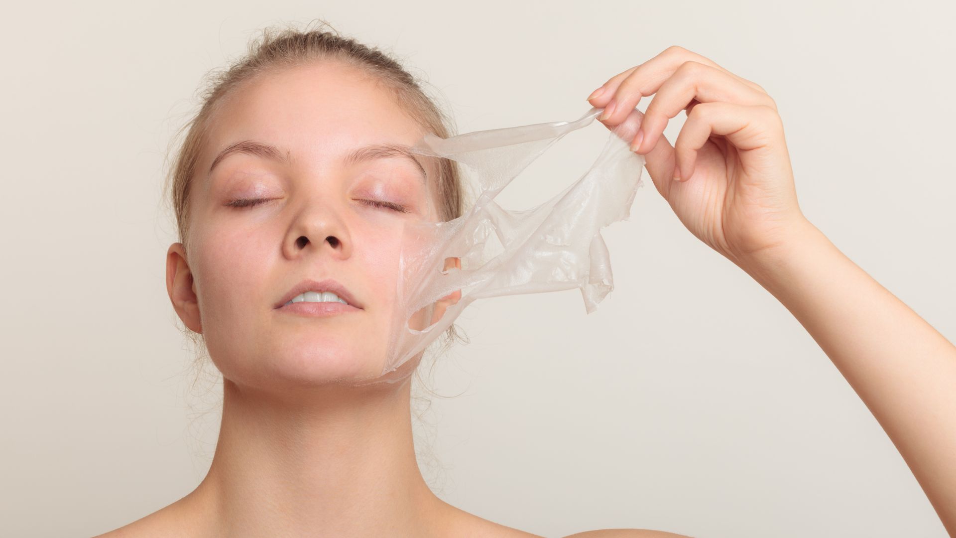 A woman holding a plastic bag over her face